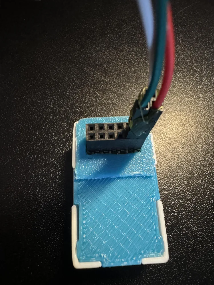 Hot glue joining the outer shells of three DuPont connectors