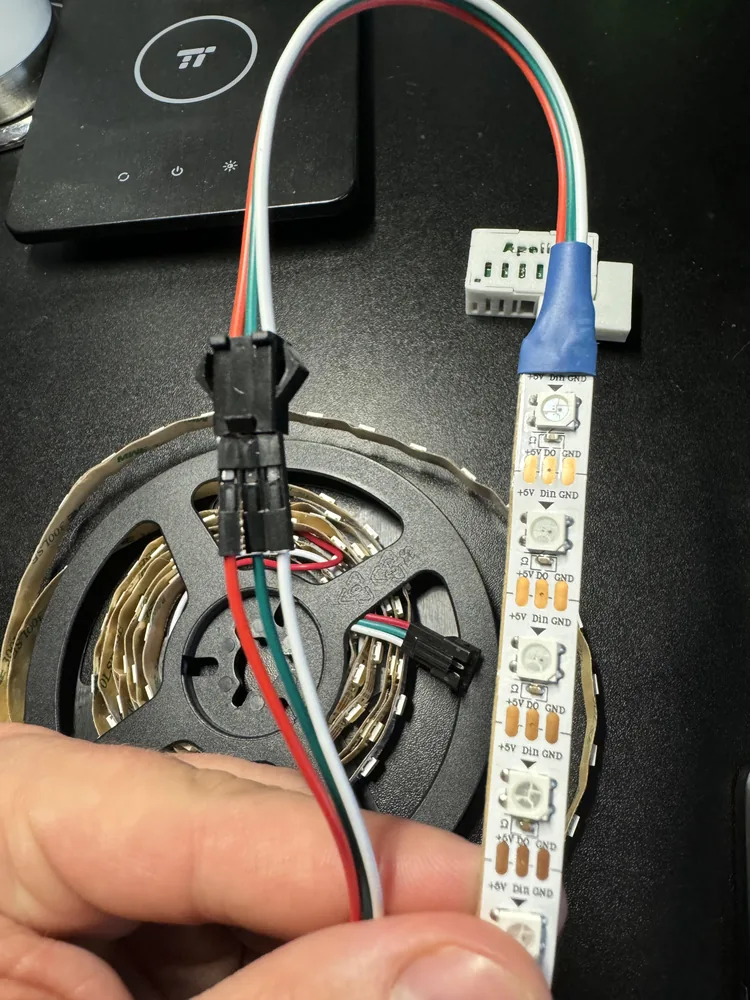 Direction arrow printed on the LED strip pointing away from the sensor