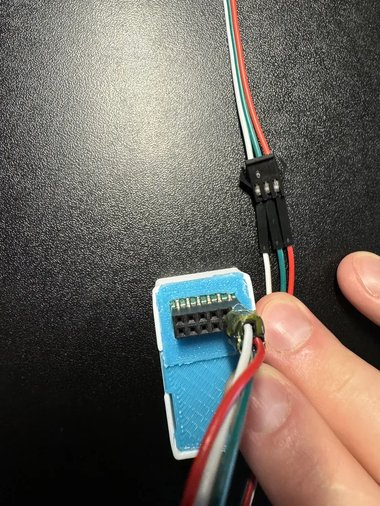 DuPont wires plugged into the strip's JST-SM connector
