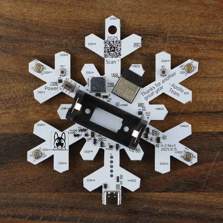 Back of the H-2 snowflake with the four gold song buttons near the tips of its four side arms