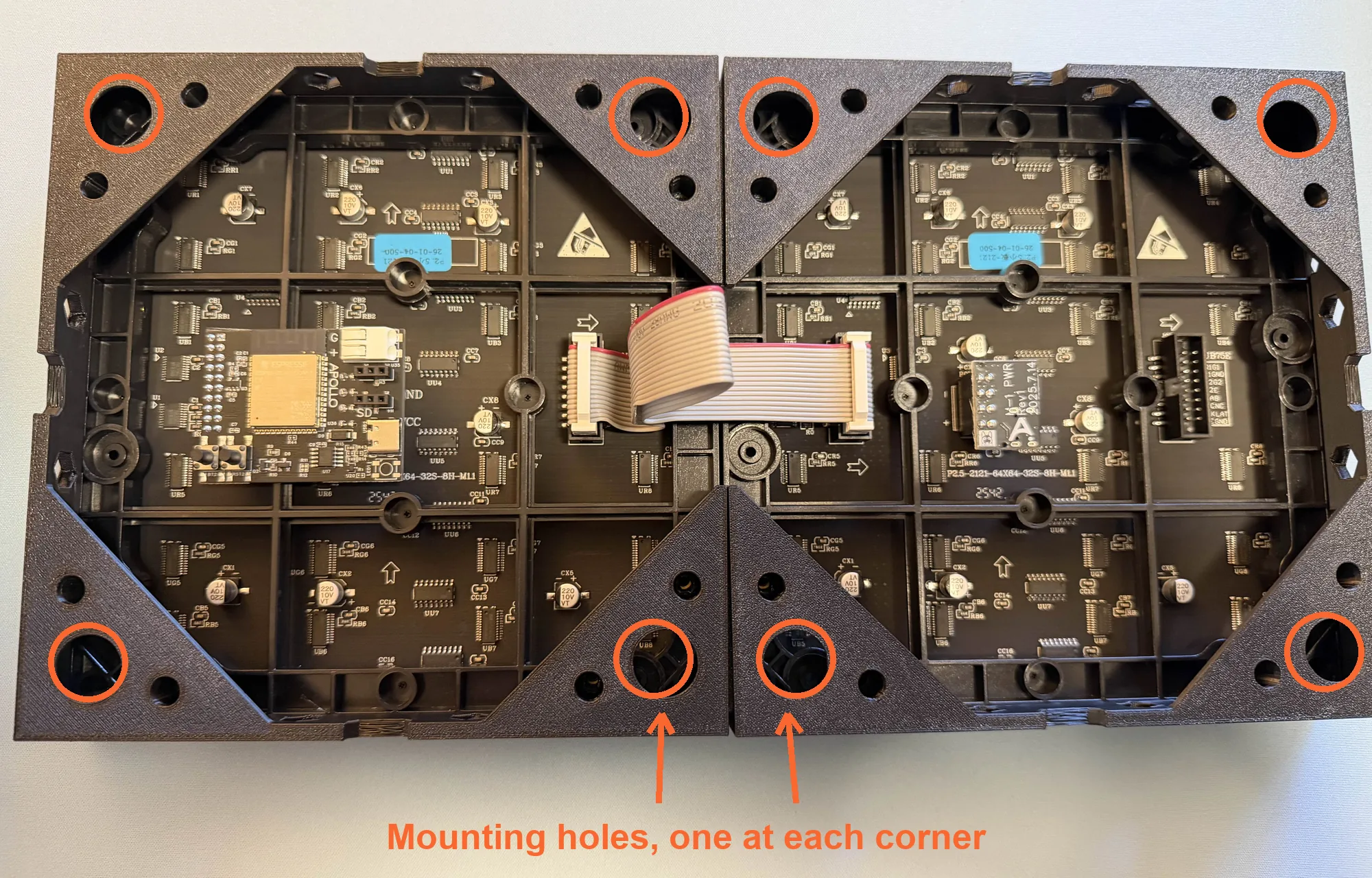The back of a two panel build with the mounting holes circled